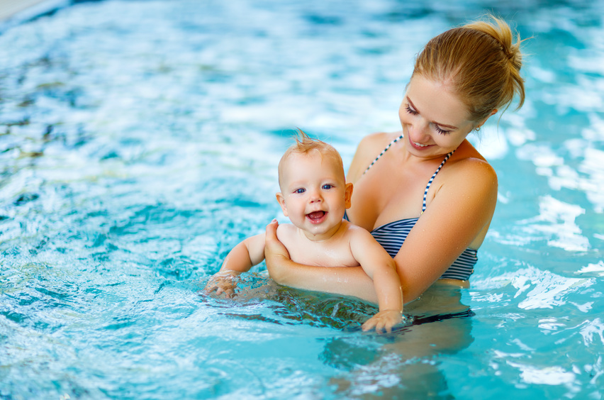 Mother and baby swim  in the pool